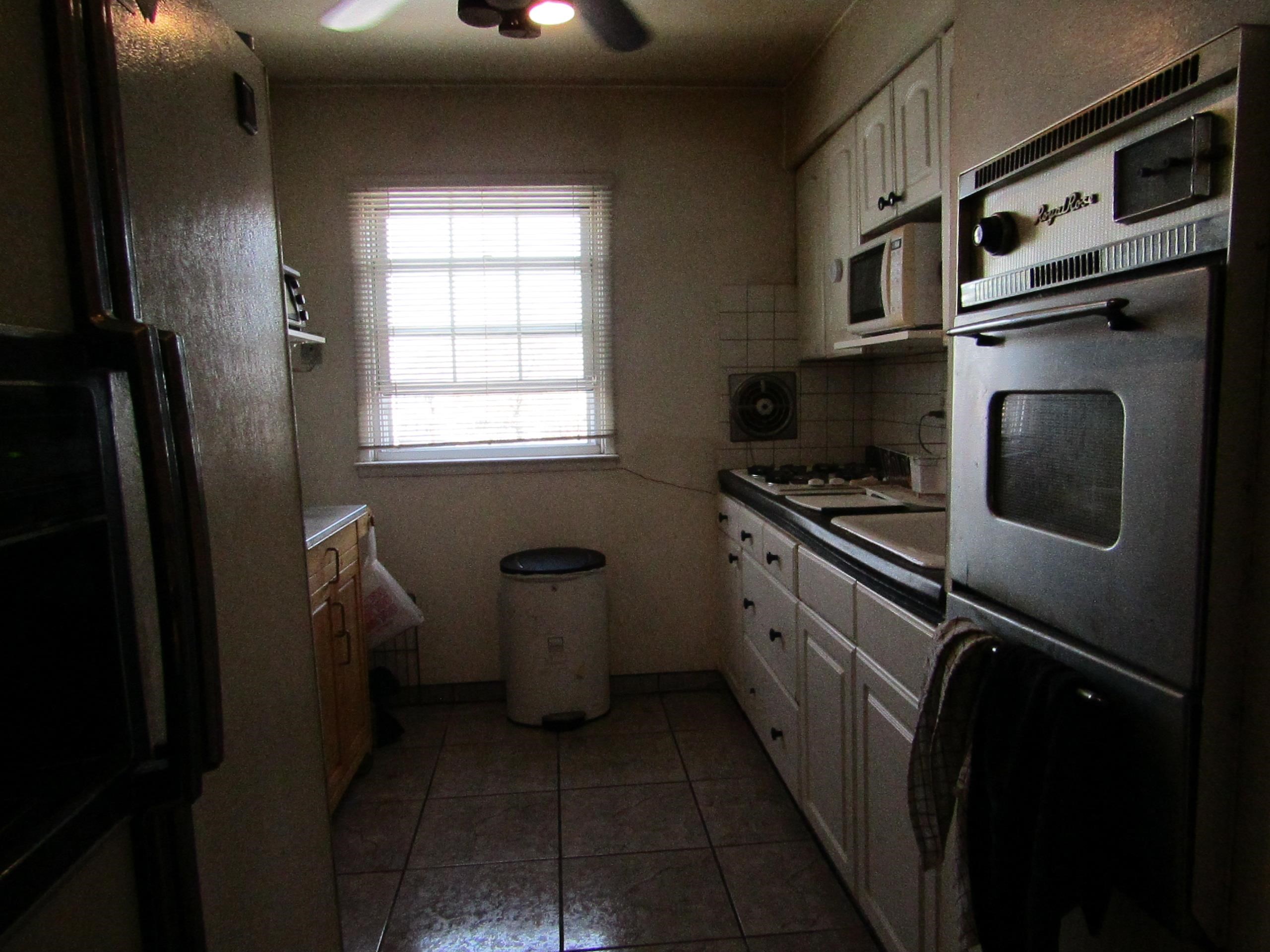 31 Exeter Road Jersey City, NJ 07305 - Photo 10 of 39 a kitchen with a refrigerator and a stove