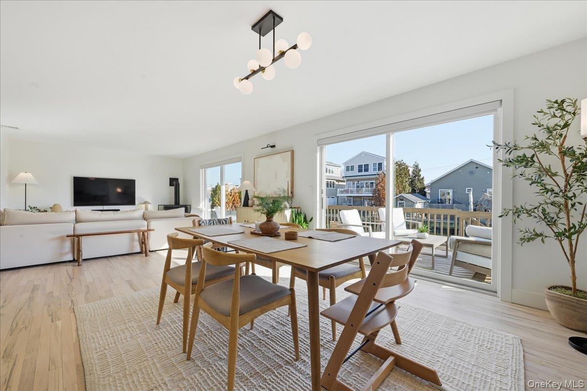 141 Annuskemunnica Road Babylon, NY 11702 - Photo 11 of 44 a view of a dining room with furniture window and outside view