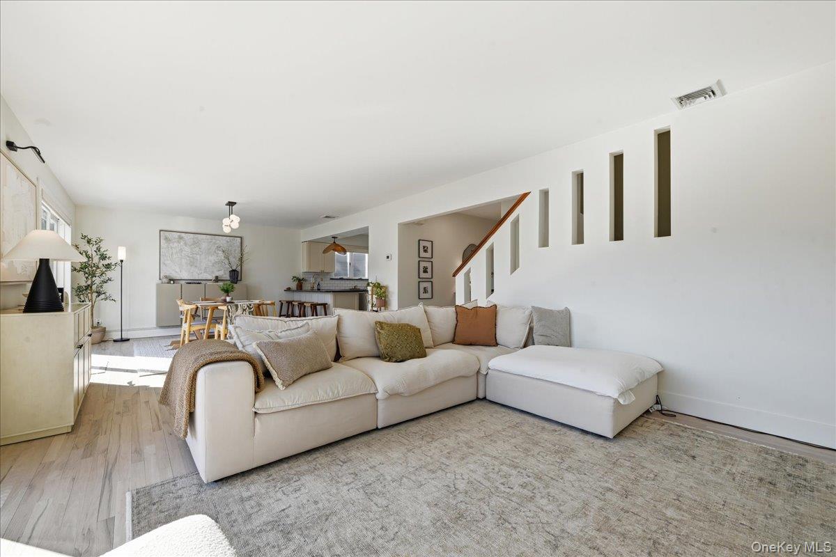 141 Annuskemunnica Road Babylon, NY 11702 - Photo 14 of 44 a living room with furniture and a couch