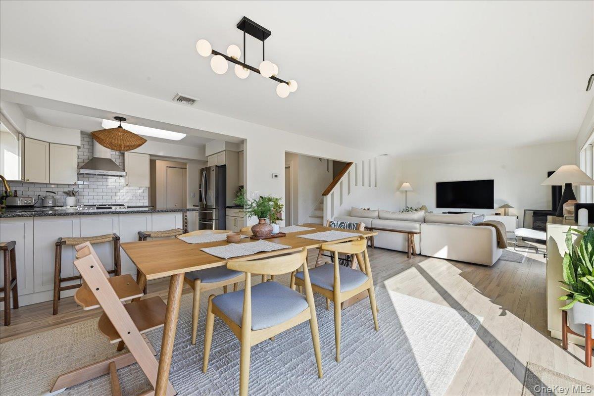 141 Annuskemunnica Road Babylon, NY 11702 - Photo 15 of 44 a view of a dining room with furniture