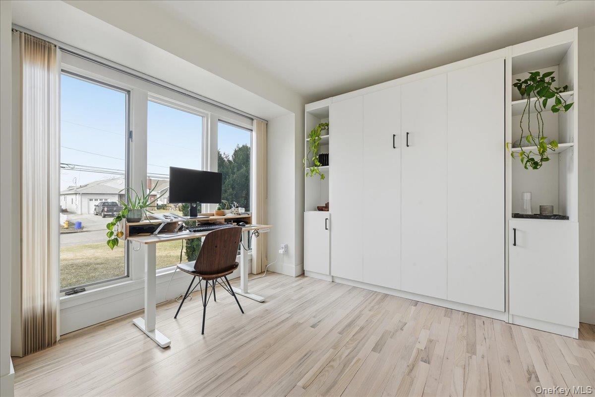 141 Annuskemunnica Road Babylon, NY 11702 - Photo 17 of 44 a view of a workspace with furniture and wooden floor