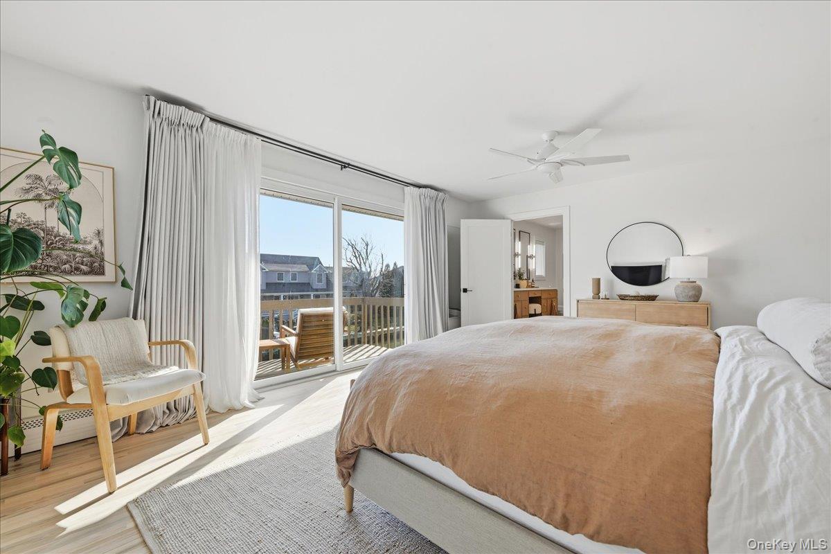 141 Annuskemunnica Road Babylon, NY 11702 - Photo 21 of 44 a bedroom with a bed and a large window