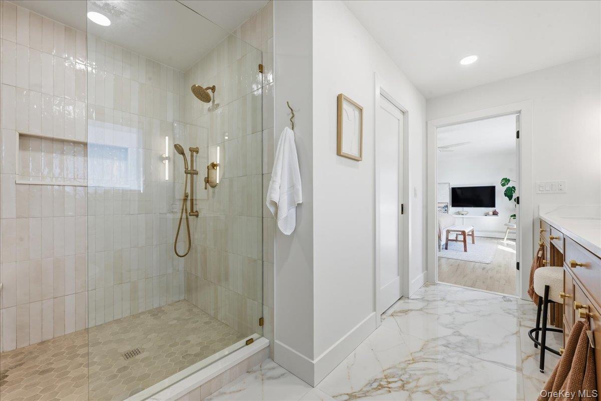 141 Annuskemunnica Road Babylon, NY 11702 - Photo 25 of 44 a bathroom with a shower and a sink