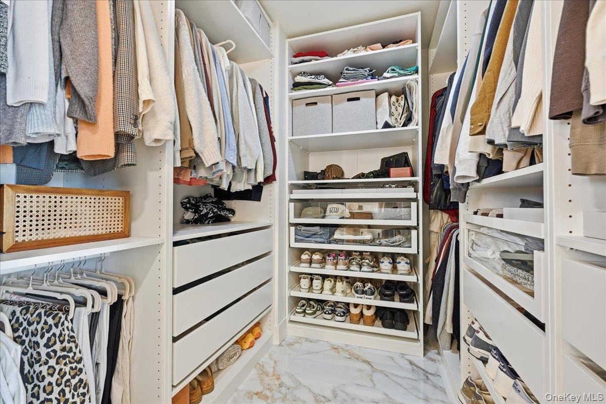 141 Annuskemunnica Road Babylon, NY 11702 - Photo 26 of 44 a view of walk in closet with clothes and shoes