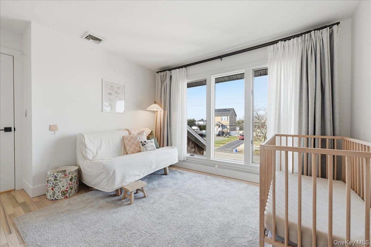 141 Annuskemunnica Road Babylon, NY 11702 - Photo 29 of 44 a living room with furniture and a table