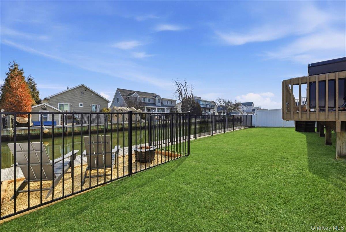 141 Annuskemunnica Road Babylon, NY 11702 - Photo 34 of 44 a view of a house with a garden and lake view