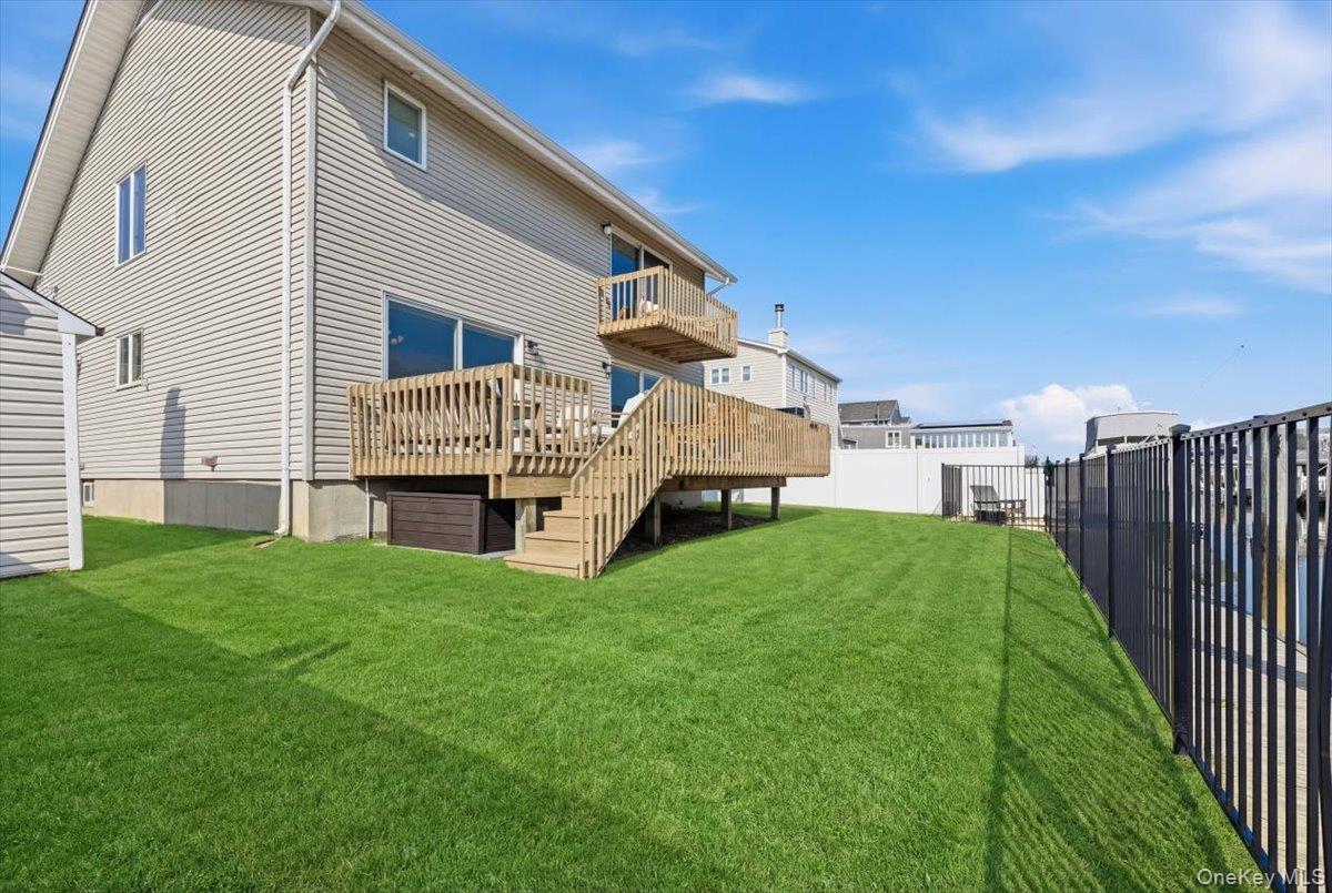 141 Annuskemunnica Road Babylon, NY 11702 - Photo 35 of 44 a view of house with backyard and deck