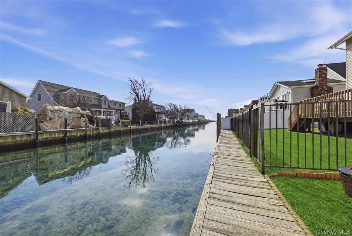 141 Annuskemunnica Road Babylon, NY 11702 - Photo 37 of 44 a view of a lake with a yard