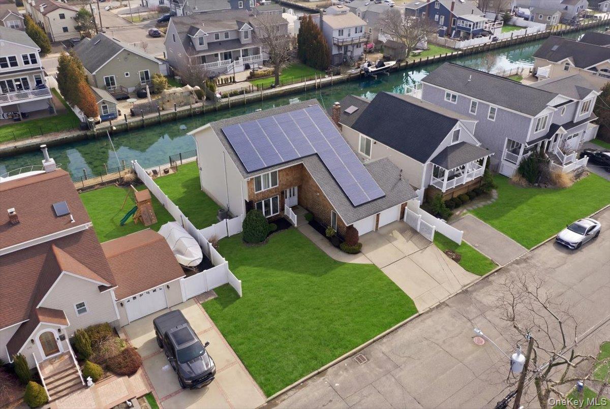 141 Annuskemunnica Road Babylon, NY 11702 - Photo 38 of 44 an aerial view of a house with a garden and lake view