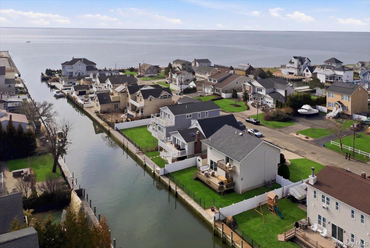 141 Annuskemunnica Road Babylon, NY 11702 - Photo 41 of 44 an aerial view of a house with a ocean view