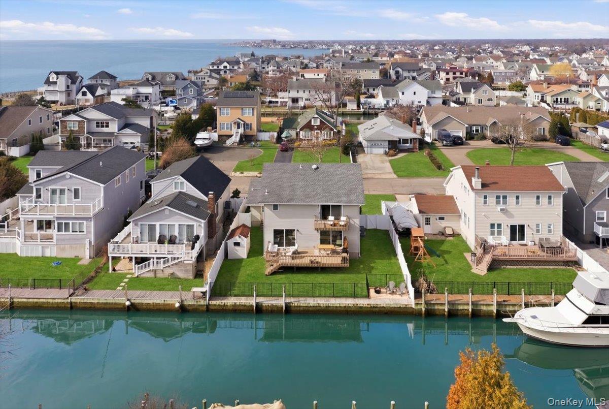 141 Annuskemunnica Road Babylon, NY 11702 - Photo 42 of 44 an aerial view of multiple houses with yard