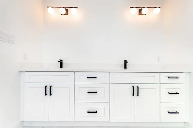 a bathroom with a glass shower door