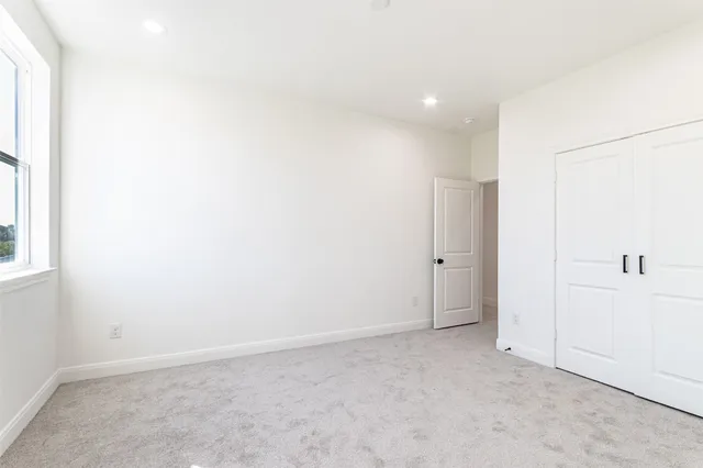 an empty room with closet area