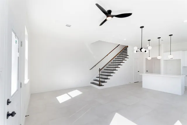a view of an empty room with stairs