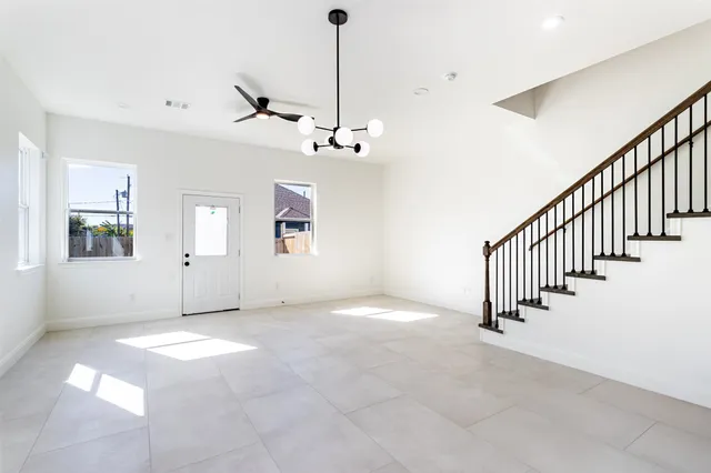 a view of a livingroom with stairs