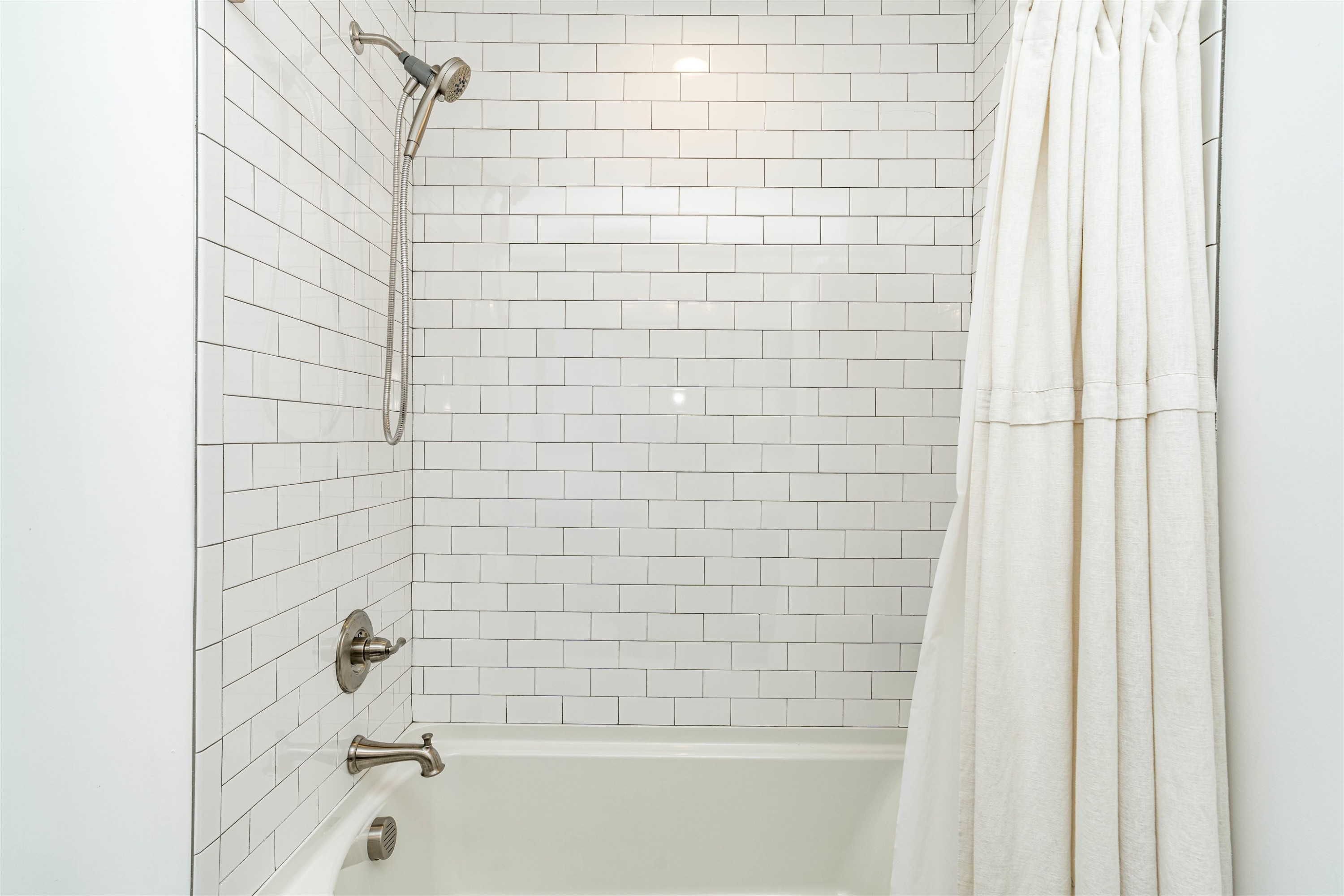 1505 Windbur Place Raleigh, NC 27609 - Photo 27 of 44 a bathroom with a bathtub