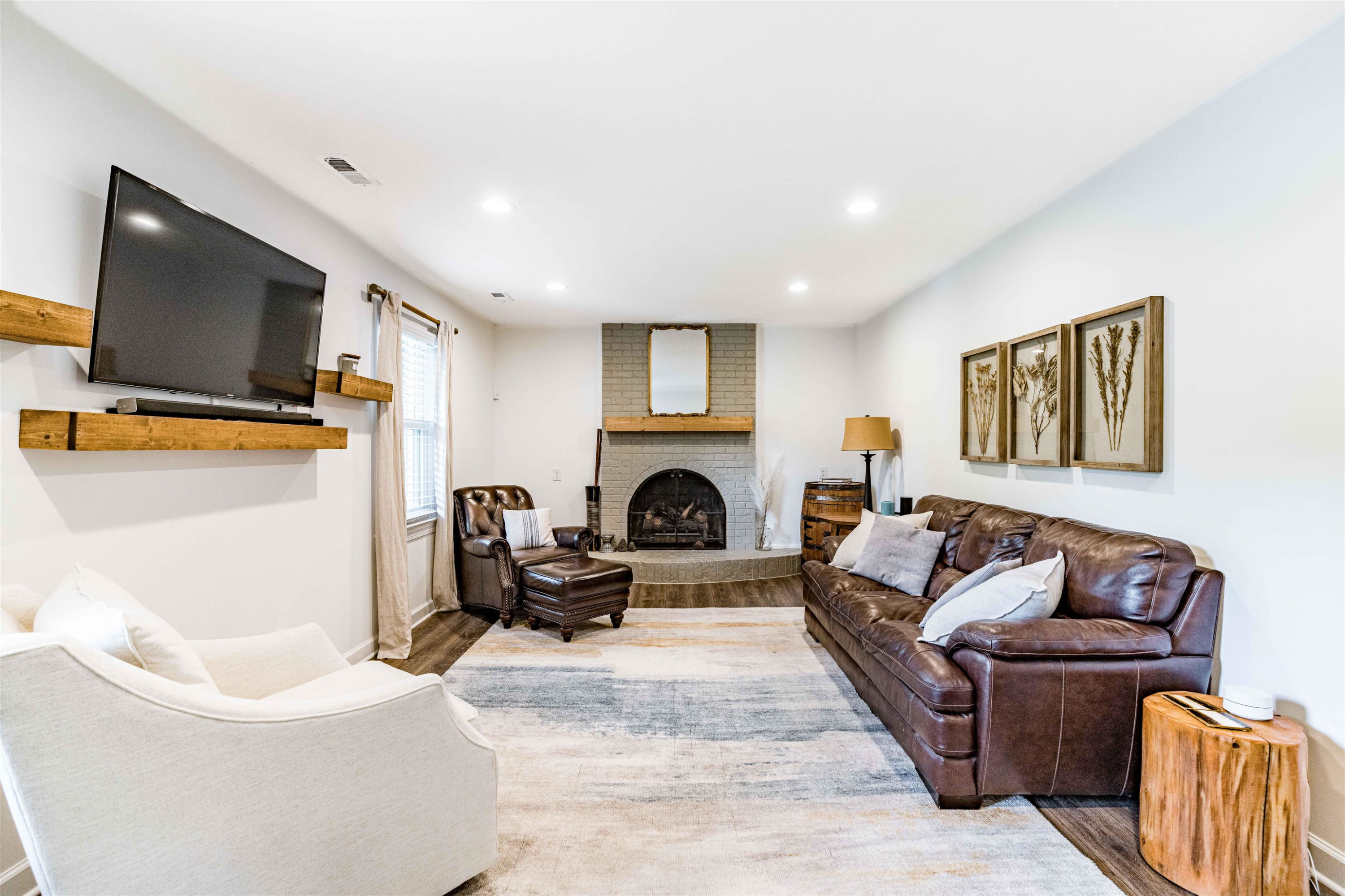 1505 Windbur Place Raleigh, NC 27609 - Photo 29 of 44 a living room with furniture and a fireplace
