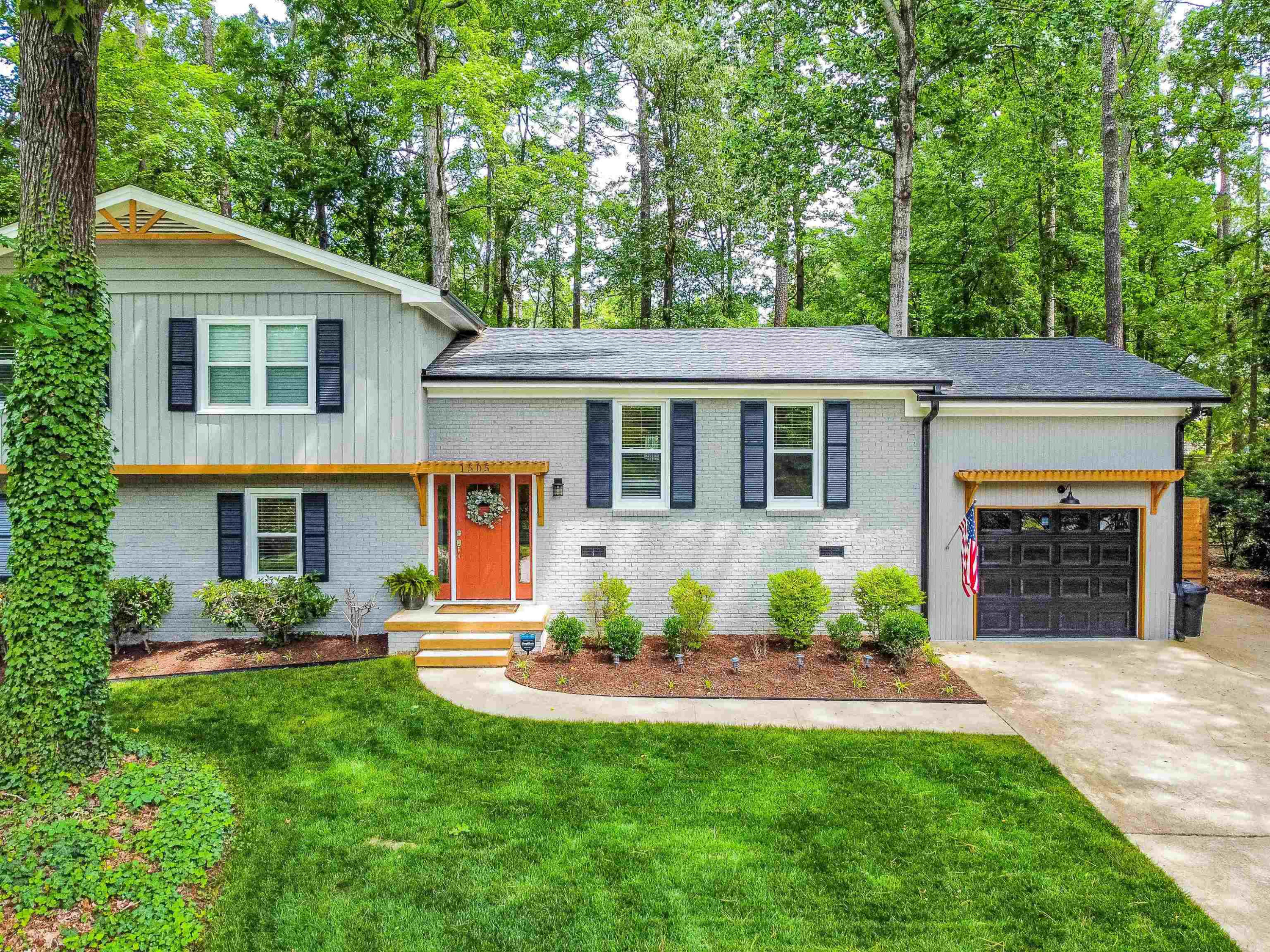 1505 Windbur Place Raleigh, NC 27609 - Photo 3 of 44 a front view of a house with a yard