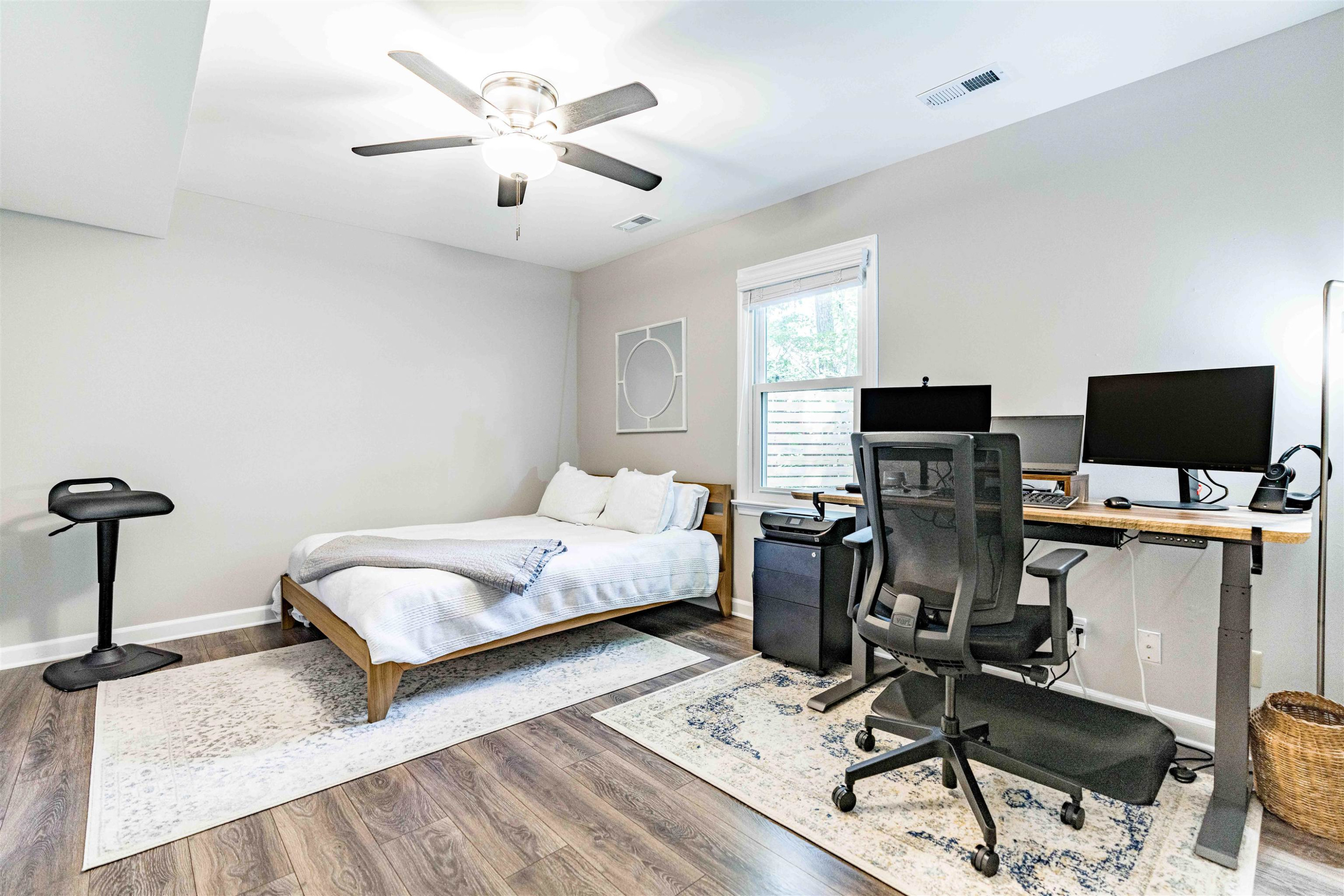 1505 Windbur Place Raleigh, NC 27609 - Photo 34 of 44 a bedroom with bed a computer on a desk and chair