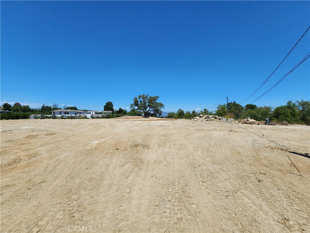 24005 Hidden Ridge Road Hidden Hills, CA 91302 - Photo 2 of 7 Looking across the middle of the building pad to the Oak tree at the end of the pad.