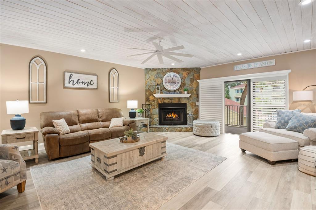 529 Sandy Hook Road Treasure Island, FL 33706 - Photo 6 of 55 a living room with furniture and a fireplace