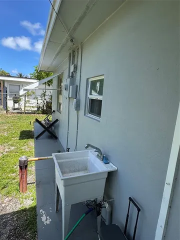 a balcony with table and chairs