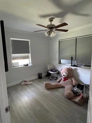 a room with furniture window and a ceiling fan