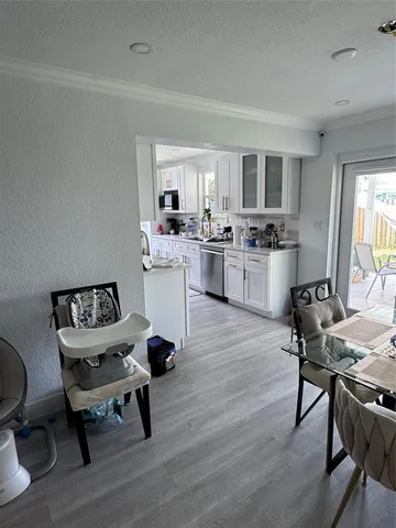 a workspace with furniture window and wooden floor