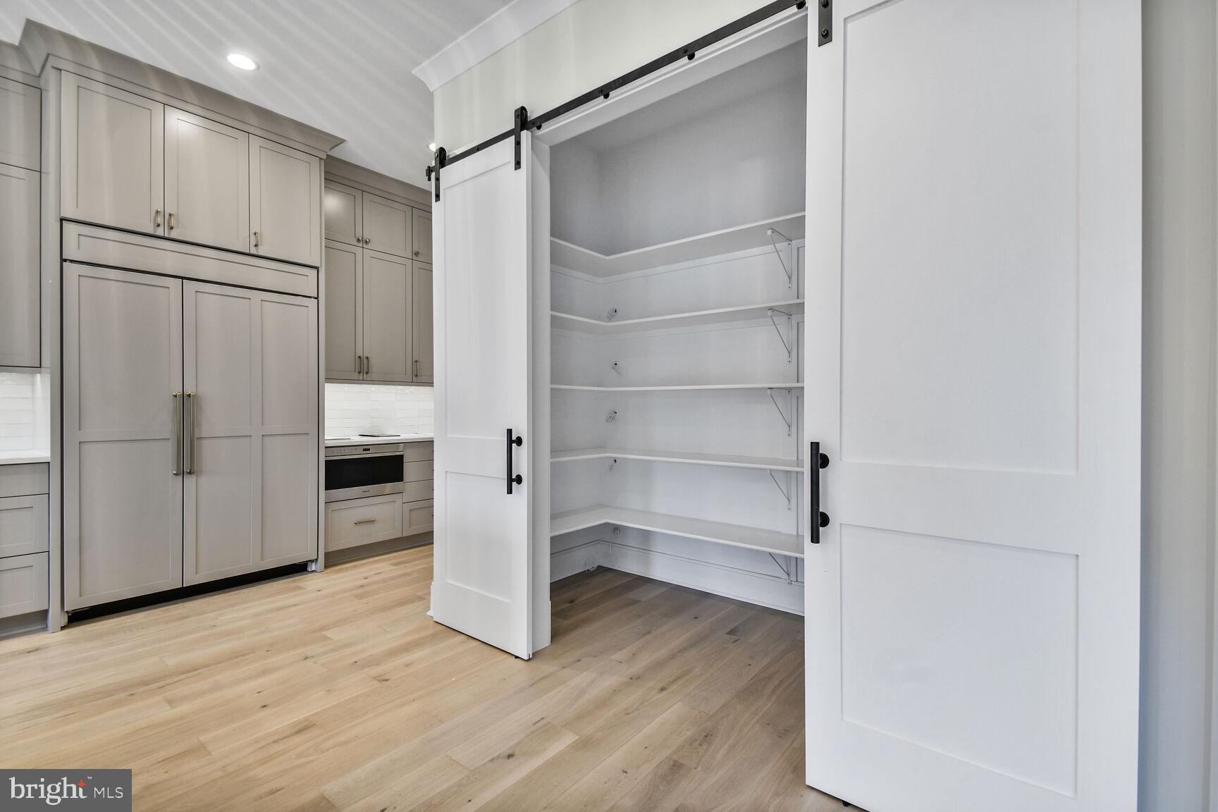 7819 Exeter Road Bethesda, MD 20814 - Photo 12 of 44 a view of walk in closet with empty racks