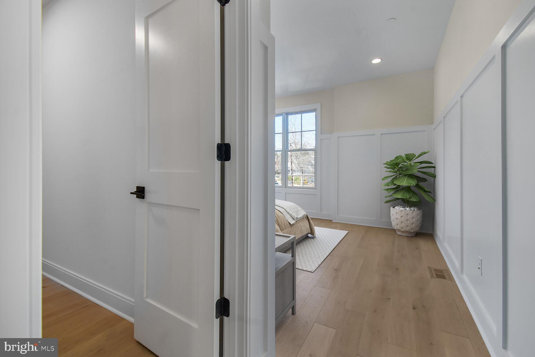 7819 Exeter Road Bethesda, MD 20814 - Photo 31 of 44 a view of a hallway with closet and wooden floor