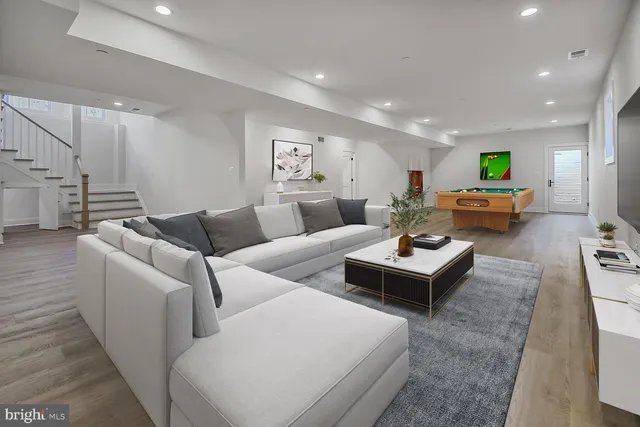 a living room with furniture and a table