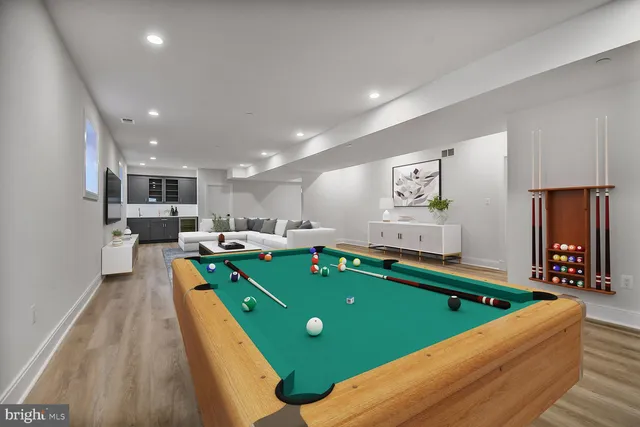 a room with pool table table and chairs