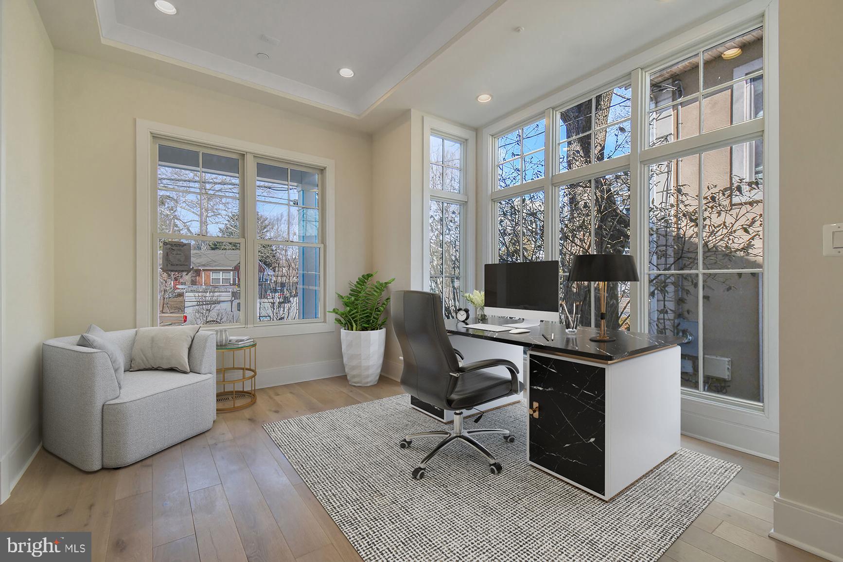 7819 Exeter Road Bethesda, MD 20814 - Photo 4 of 44 a view of a livingroom with workspace and a couch
