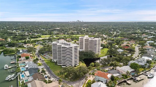 an aerial view of residential building and lake