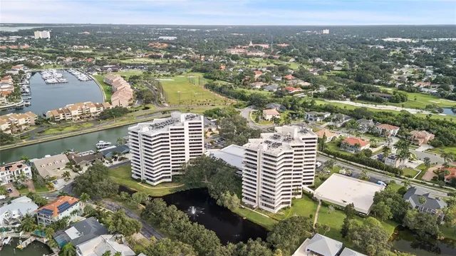 an aerial view of a city with lake view