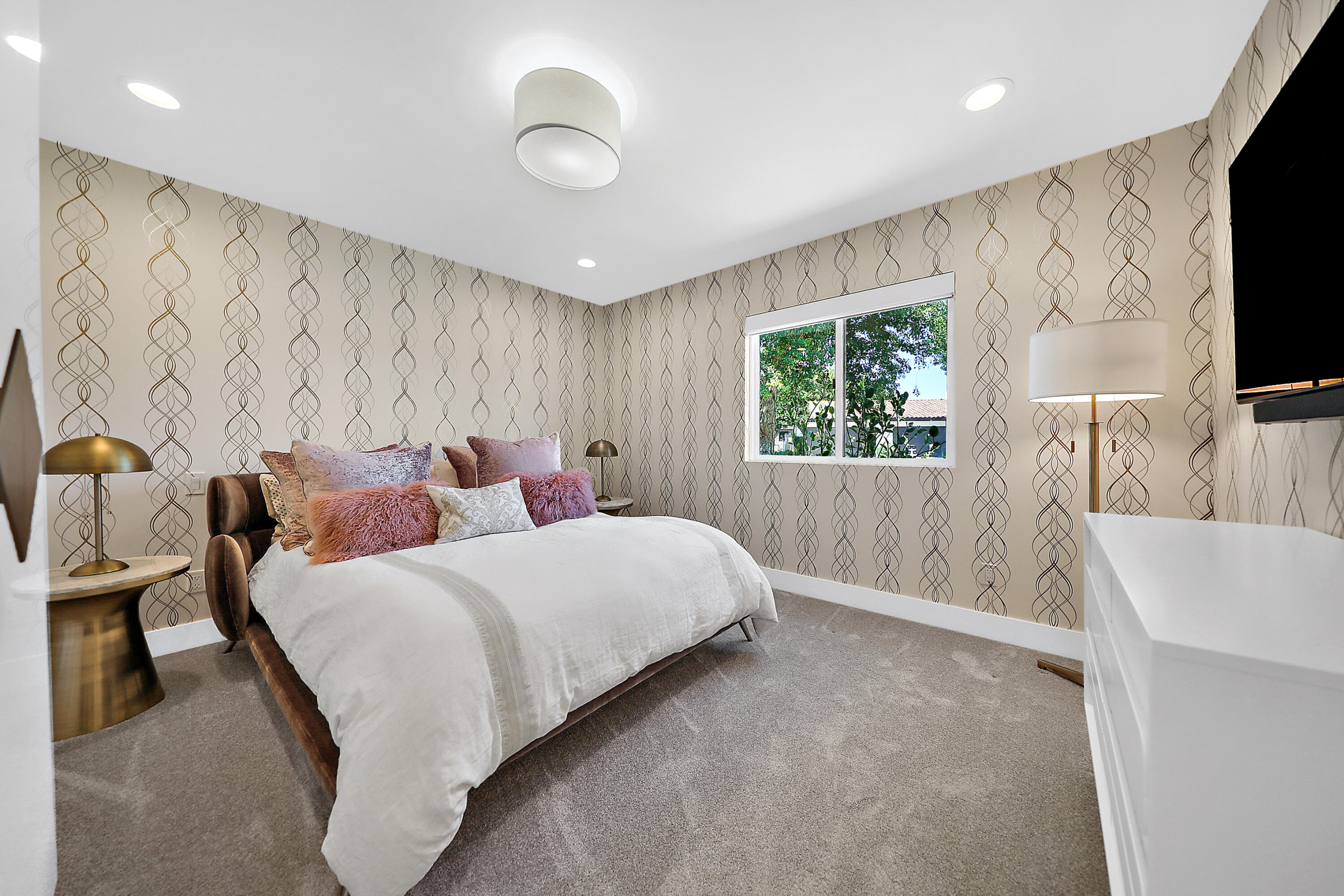 24 Leon Way Rancho Mirage, CA 92270 - Photo 13 of 30 a bedroom with bed and window