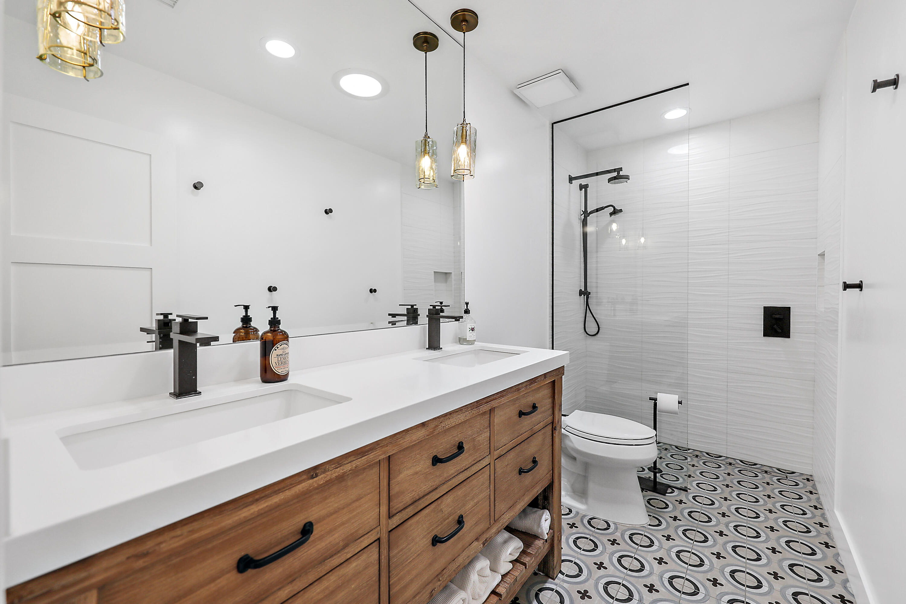 24 Leon Way Rancho Mirage, CA 92270 - Photo 14 of 30 a bathroom with a sink a toilet and a mirror