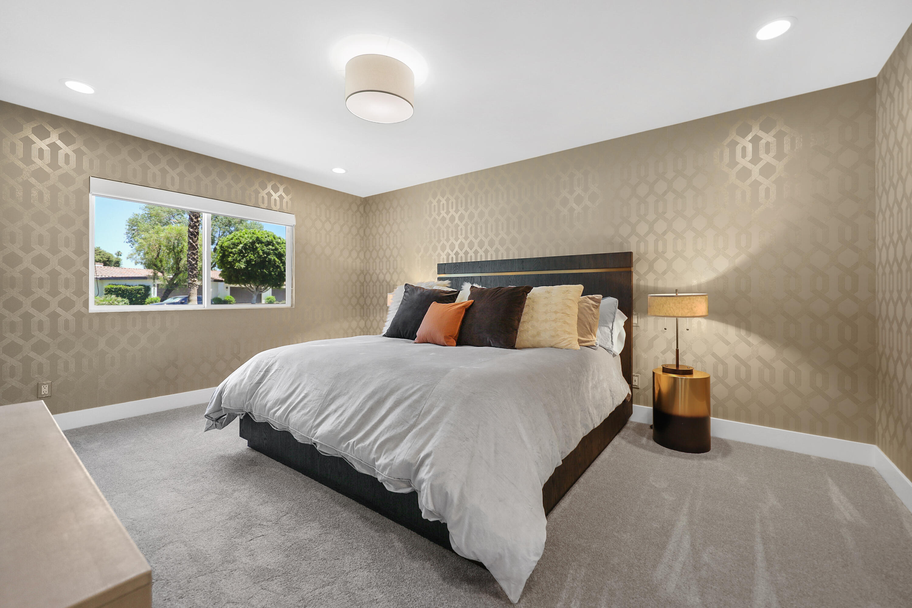 24 Leon Way Rancho Mirage, CA 92270 - Photo 15 of 30 a bedroom with a bed and window