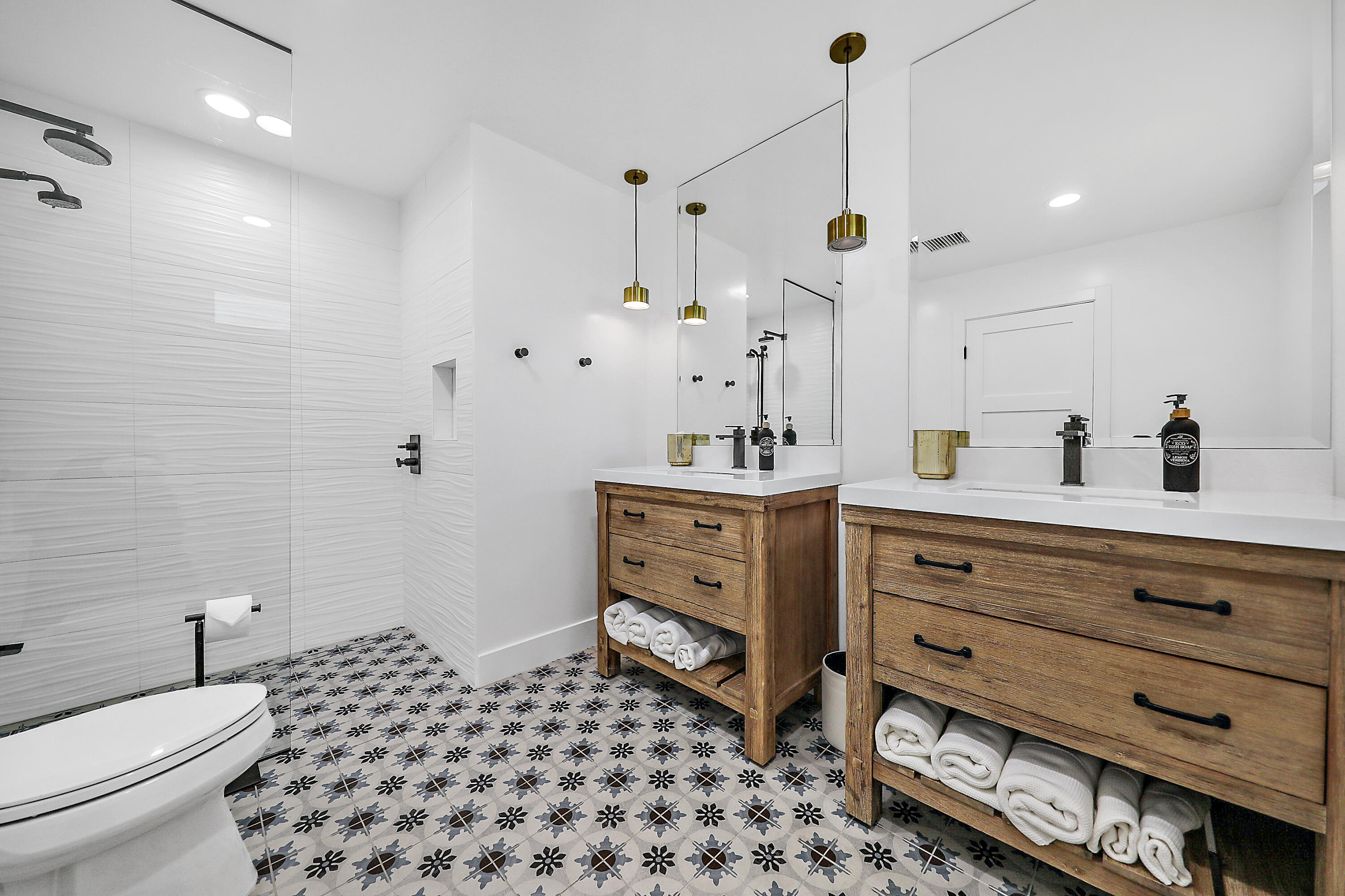 24 Leon Way Rancho Mirage, CA 92270 - Photo 17 of 30 a bathroom with a sink a toilet a shower and a mirror