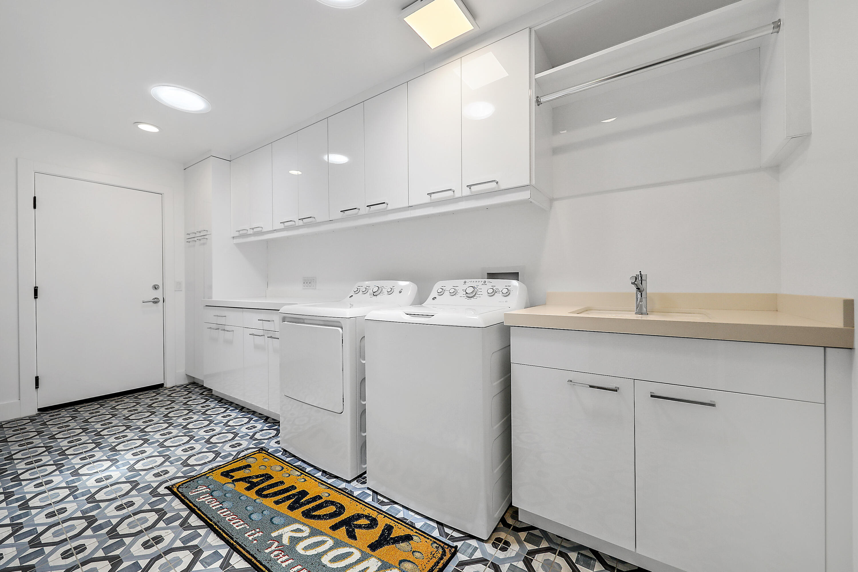 24 Leon Way Rancho Mirage, CA 92270 - Photo 18 of 30 a storage room with a washer and dryer