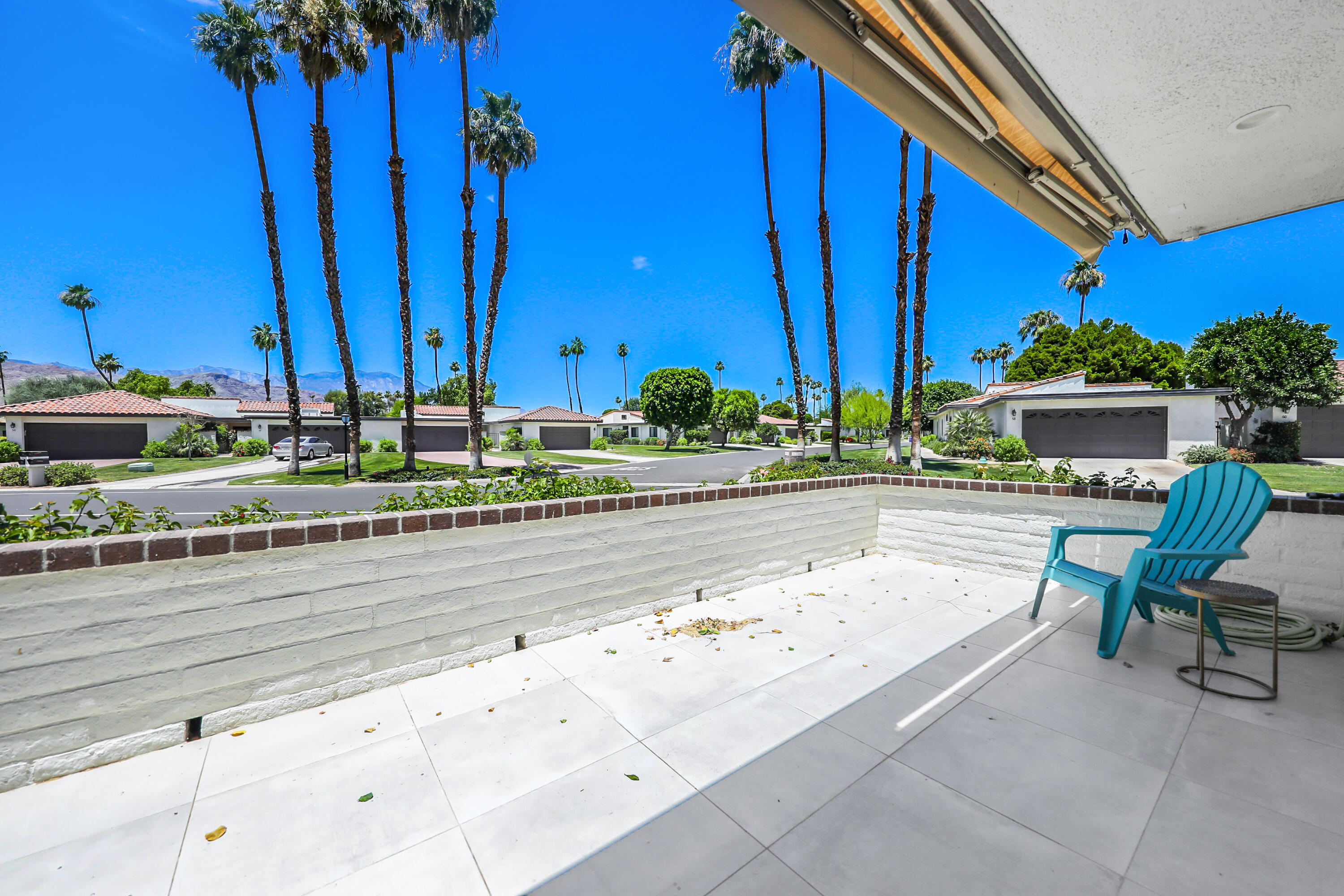 24 Leon Way Rancho Mirage, CA 92270 - Photo 20 of 30 a view of a swimming pool with a chair