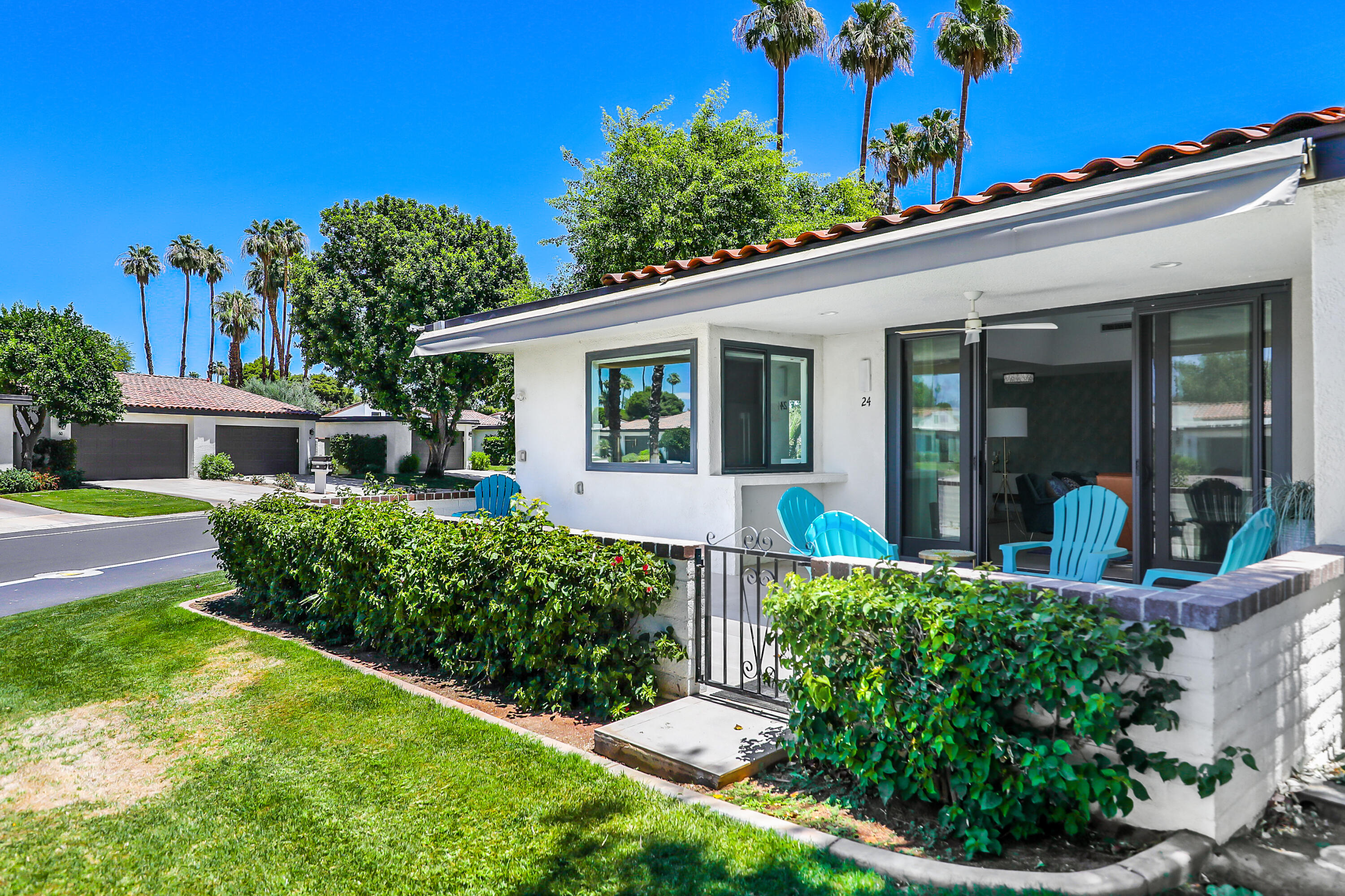 24 Leon Way Rancho Mirage, CA 92270 - Photo 21 of 30 front view of a house with a yard