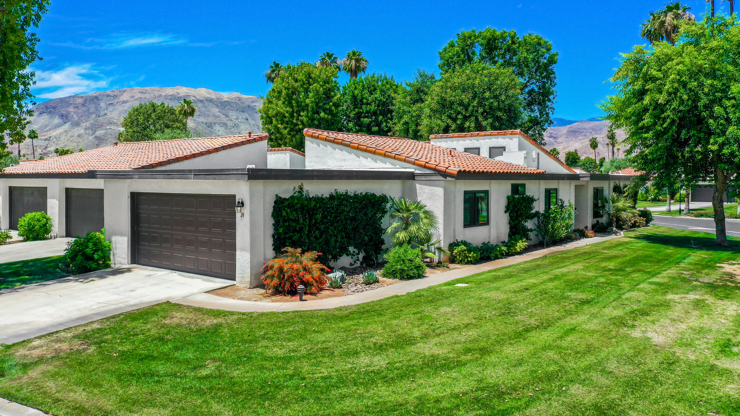 24 Leon Way Rancho Mirage, CA 92270 - Photo 23 of 30 a view of a house with backyard sitting area and garden