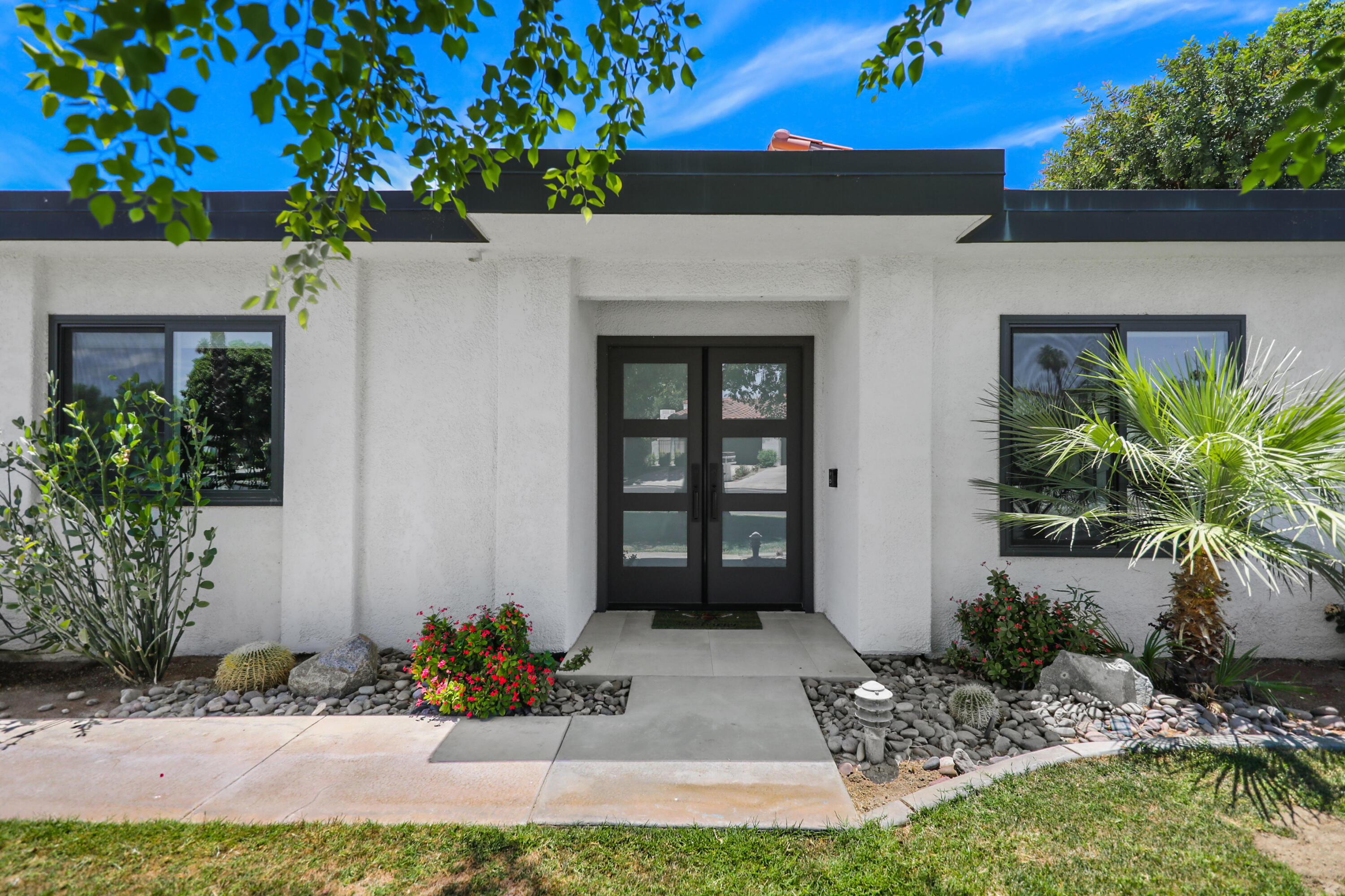 24 Leon Way Rancho Mirage, CA 92270 - Photo 24 of 30 a view of a entryway door of the house