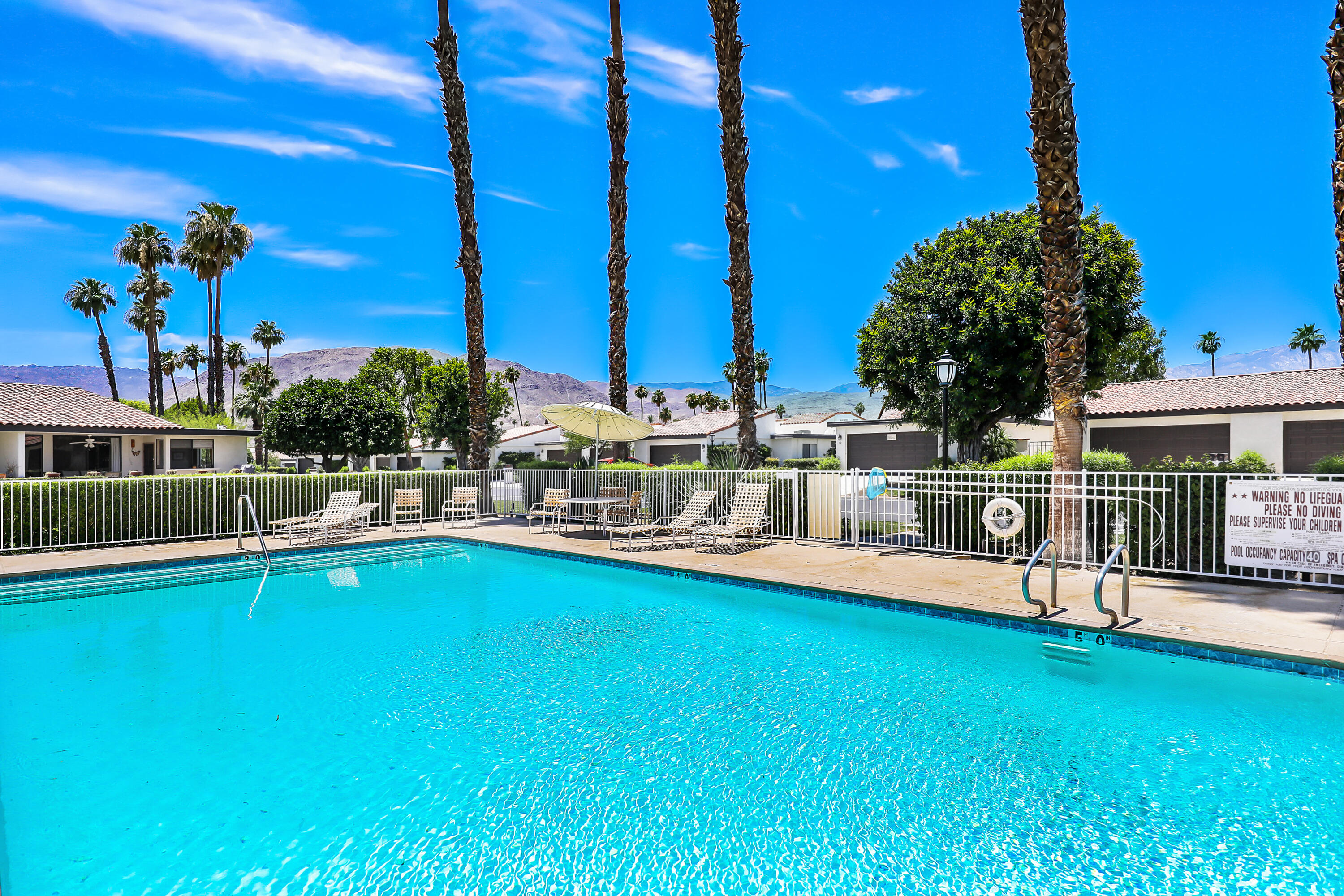 24 Leon Way Rancho Mirage, CA 92270 - Photo 26 of 30 a view of a house with swimming pool and sitting area
