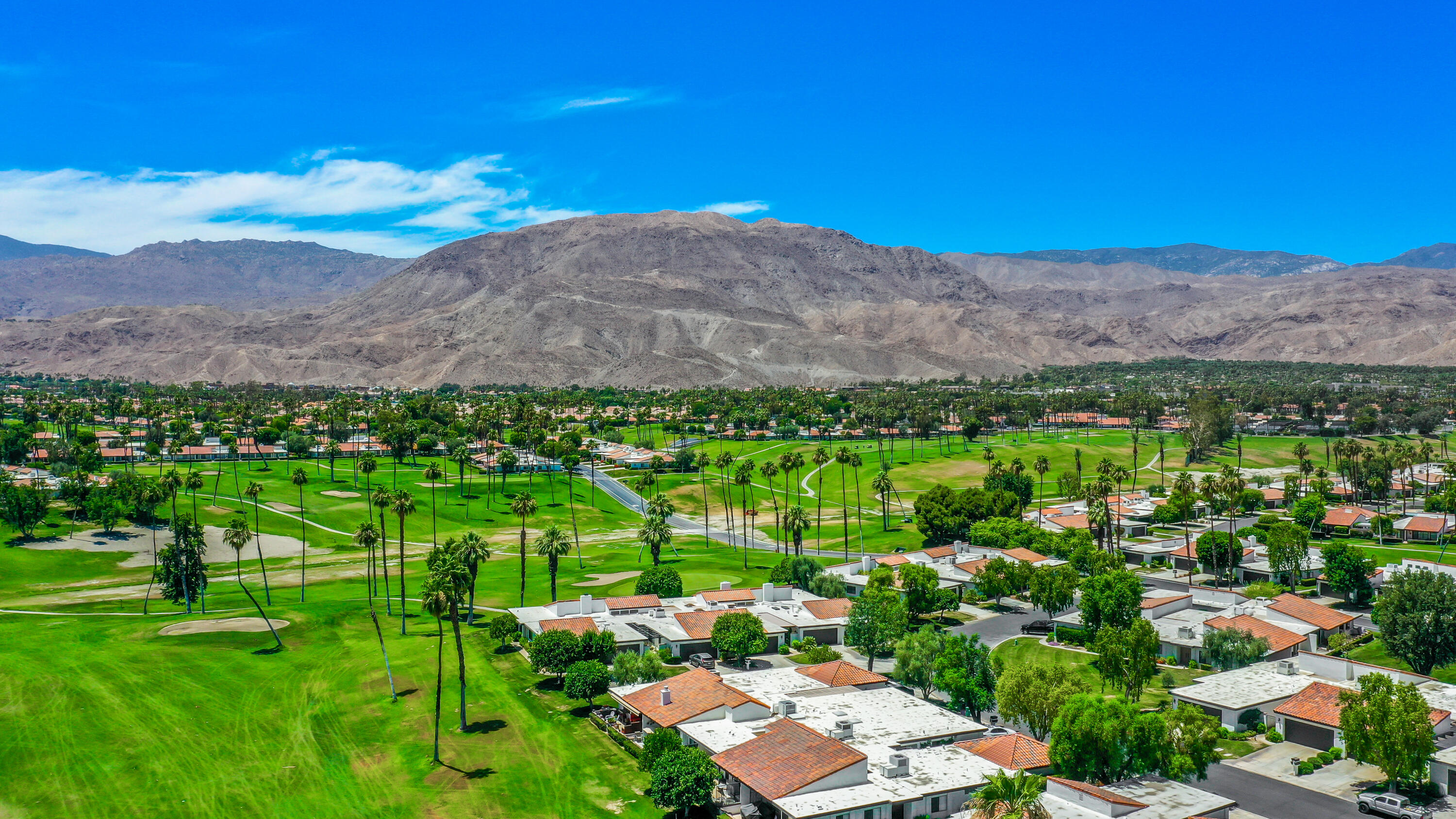 24 Leon Way Rancho Mirage, CA 92270 - Photo 30 of 30 a view of a lush green hillside and houses