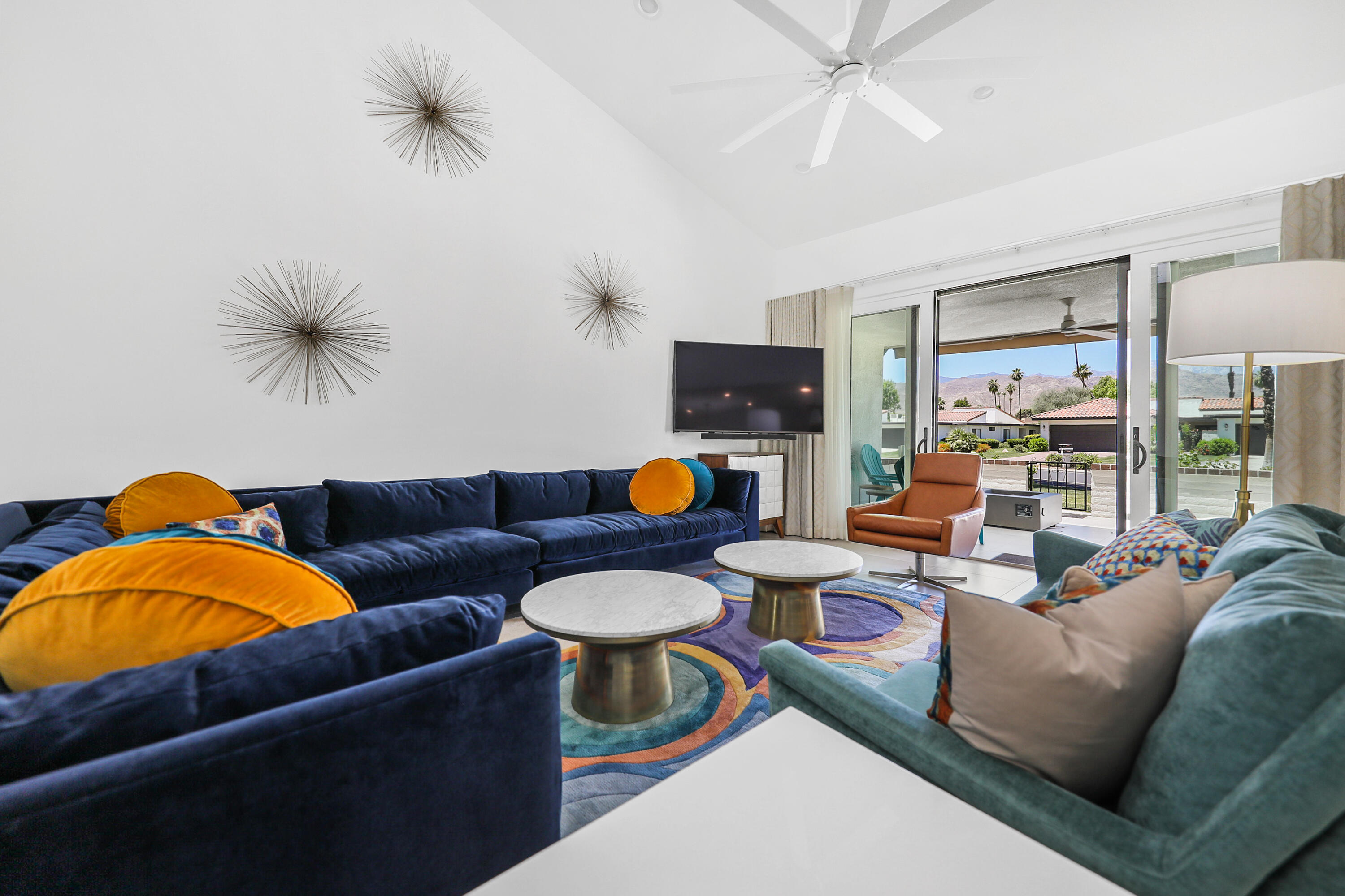 24 Leon Way Rancho Mirage, CA 92270 - Photo 3 of 30 a living room with furniture and a lamp