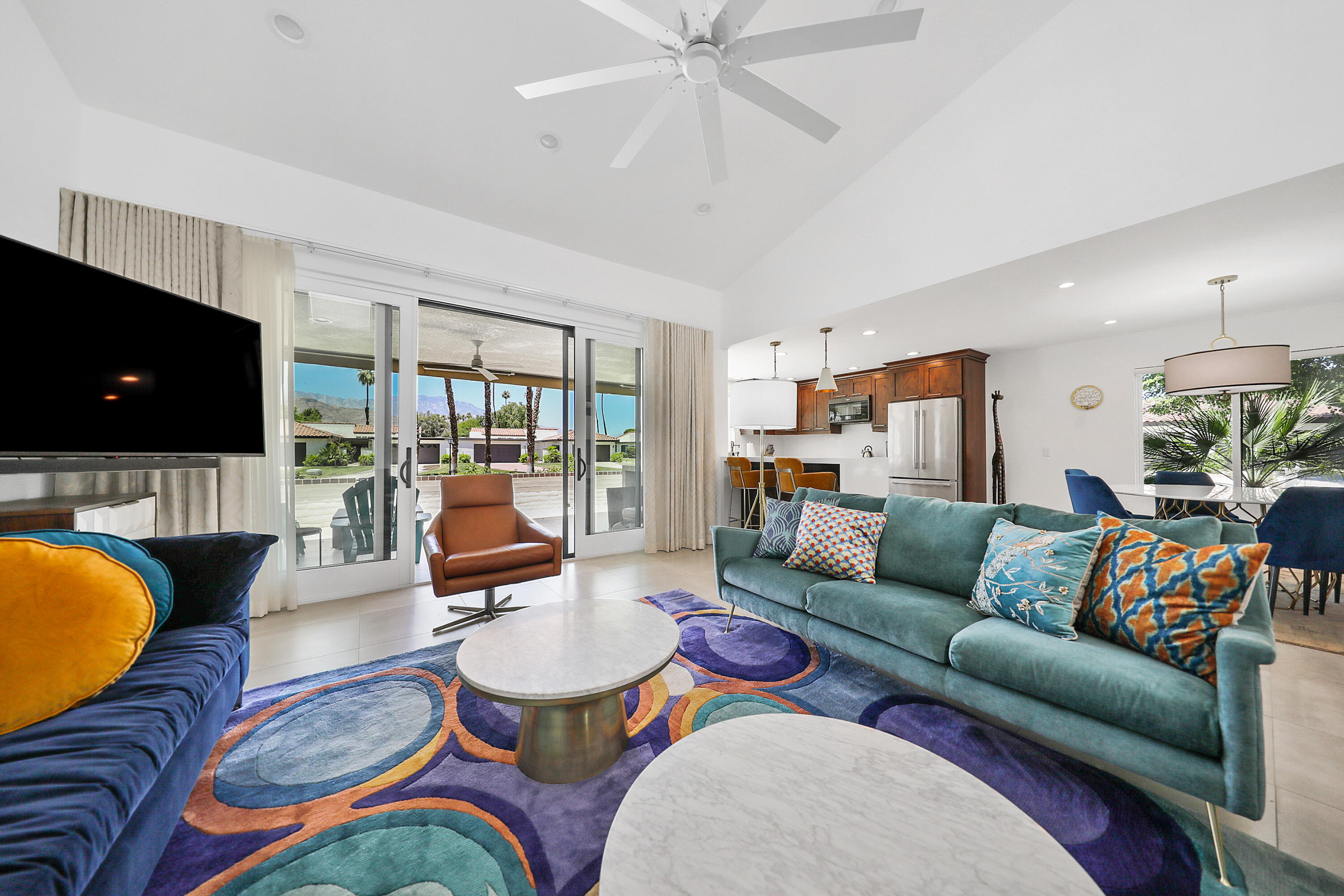 24 Leon Way Rancho Mirage, CA 92270 - Photo 5 of 30 a living room with furniture flat screen tv and a large window