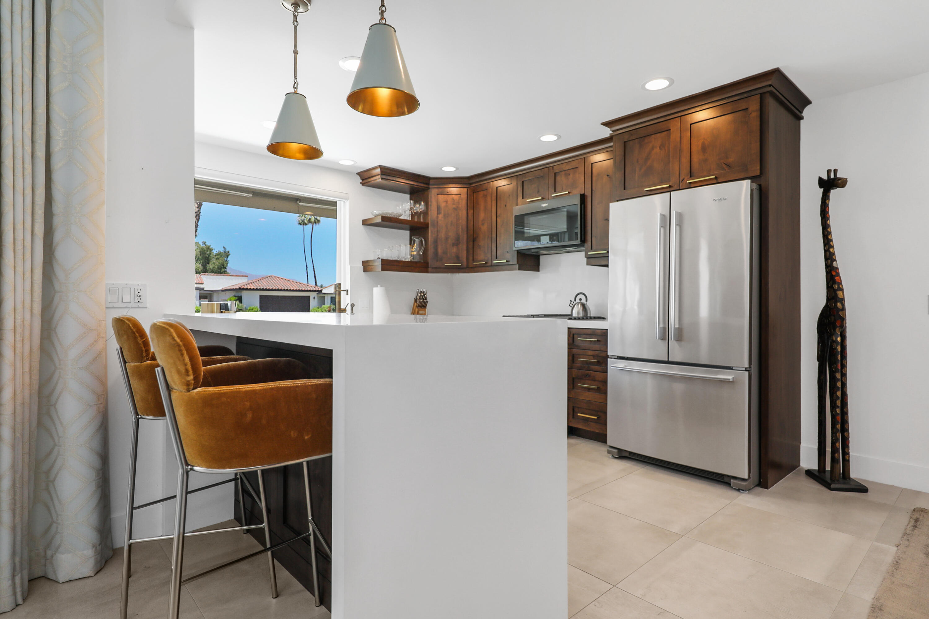 24 Leon Way Rancho Mirage, CA 92270 - Photo 7 of 30 a kitchen with stainless steel appliances granite countertop a refrigerator a stove a sink and a refrigerator