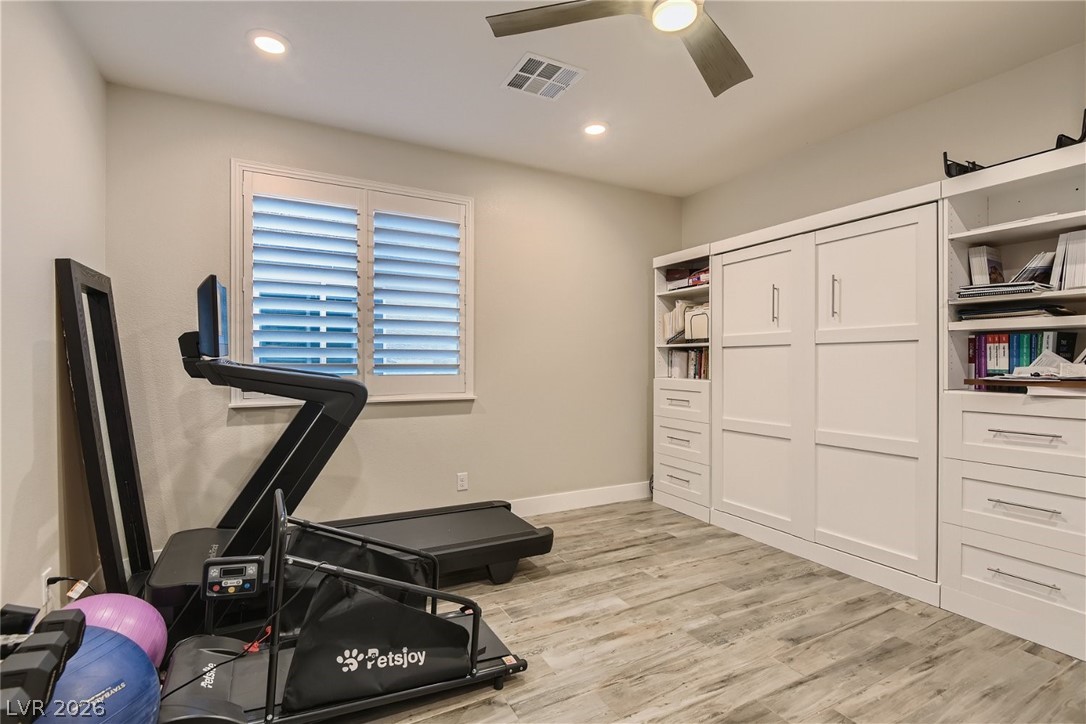 4631 Amazing View Street Las Vegas, NV 89129 - Photo 9 of 33 Well-lit room provides a versatile space, ideal for a home gym or an office, with integrated storage.